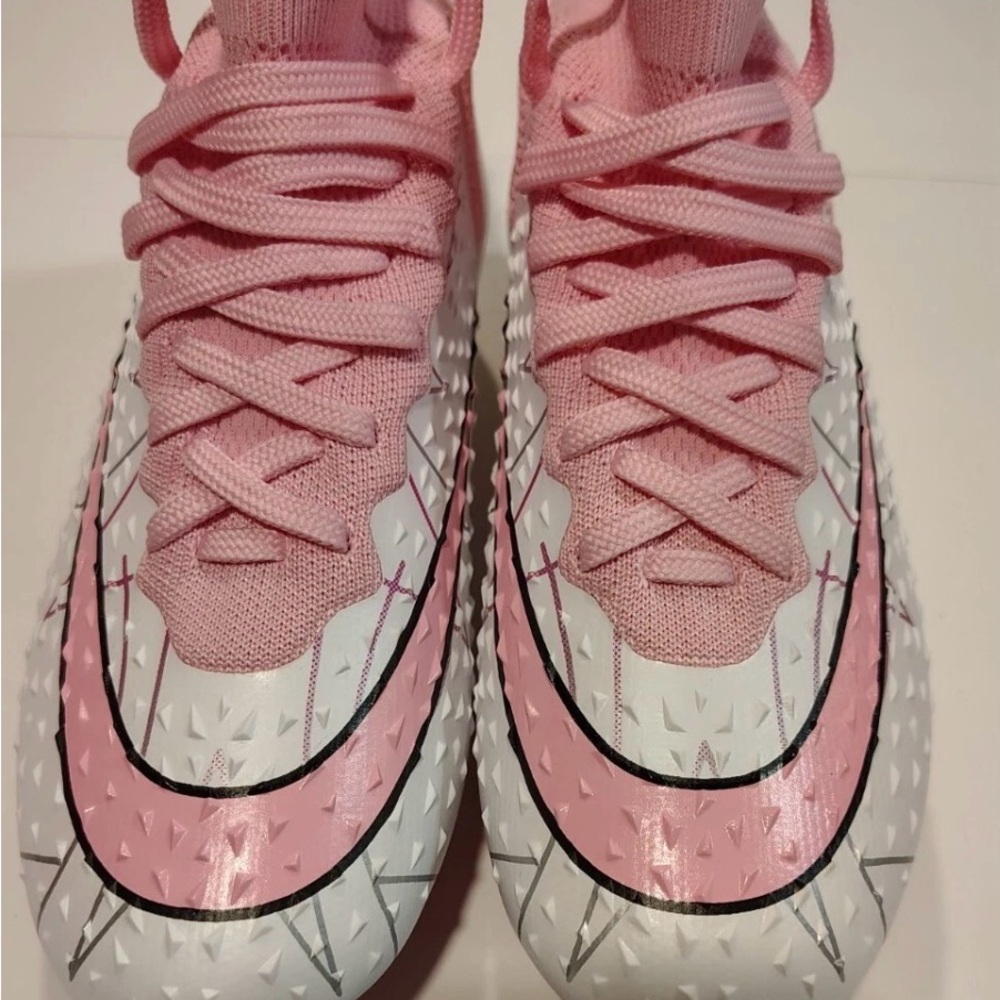 Nike / pink soccer shoes for men. Size 9.5